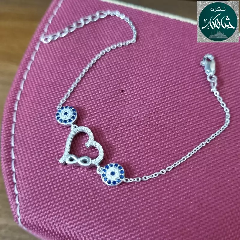 دستبند نقره زنانه شاهکار قلب و چشم نظر عیار 925 و آبکاری طلاسفید بسیار زیبا و ظریف