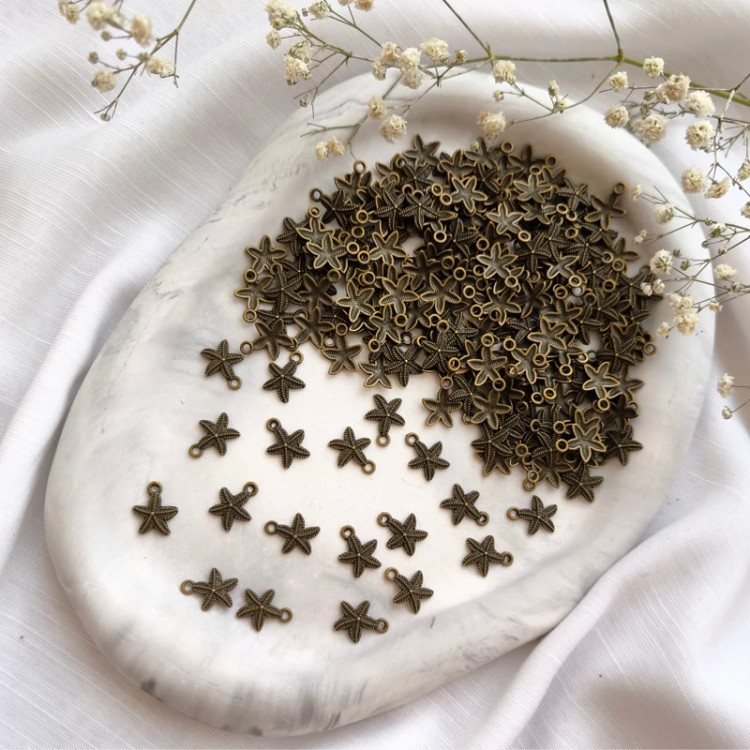 خرجکار آویز طرح ستاره دریایی ( فروش بصورت بسته 15 گرمی شامل 30 عدد آویز )