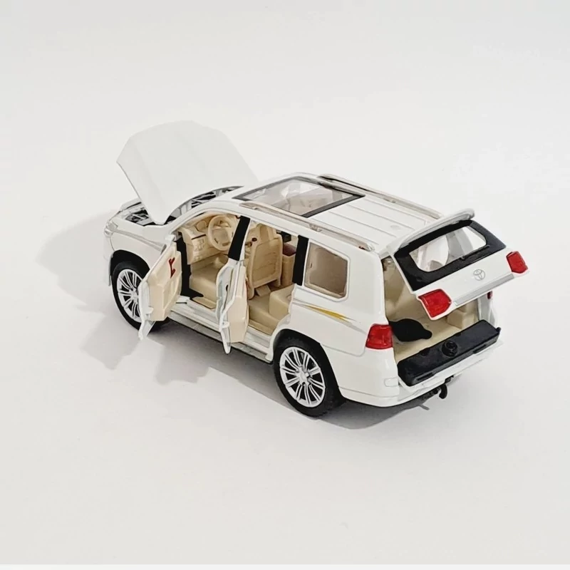 اسباب بازی ماشین فلزی تویوتا لندکروز دودزا مدل toyota land cruiser رنگ سفید